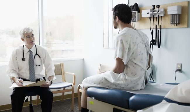 patient with Testicular Cancer consulting with doctor.